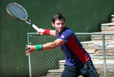 Matthew Short playing tennis