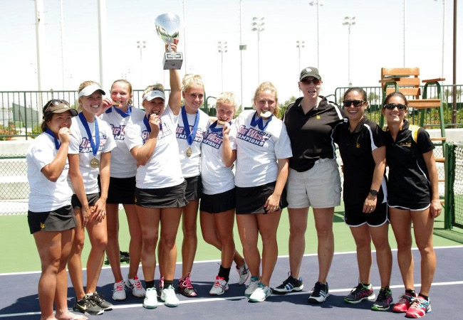 Female tennis players with trophy and medals