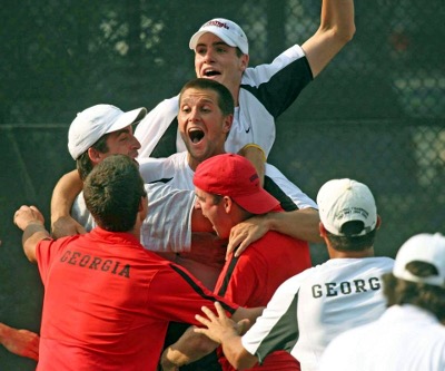 Male tennis players celebrating