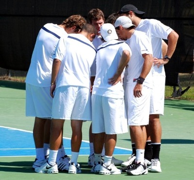 Male tennis players in a huddle