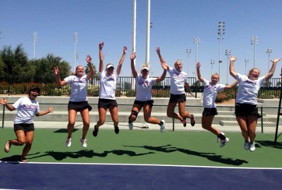 Female tennis players jumping in the air